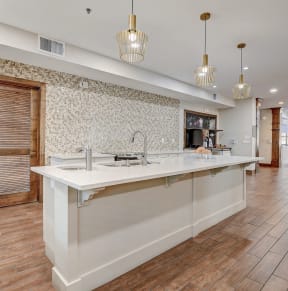 a large kitchen with a large white counter top