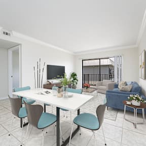 a dining room with a table and chairs and a living room