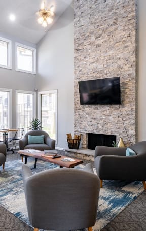 a living room filled with furniture and a fire place