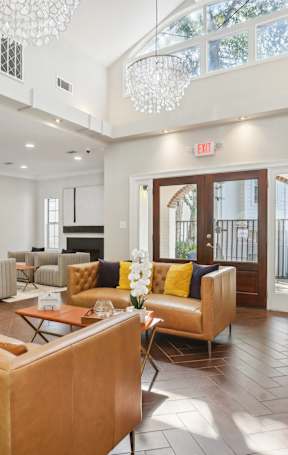 a living room and dining room with a couch and a table
