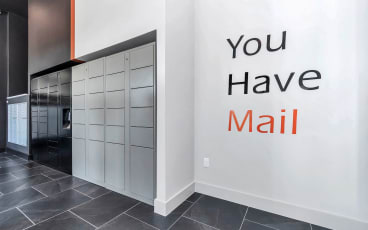 a white wall with a sign that says you have mail in front of a door