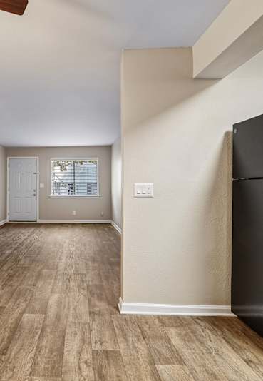 a bedroom with a bed and two windows