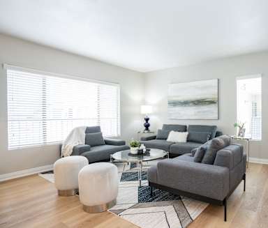 a living room with a couch and a chair and a table