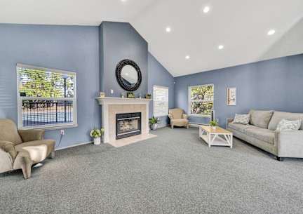 the living room has a fireplace and blue walls