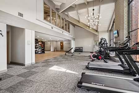 resident clubhouse with an internet café and cozy fireplace