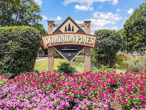 Property sign with flowers in front