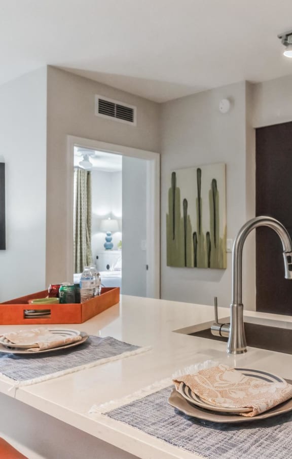 a kitchen with a sink and a stainless steel refrigerator at The Atlantic at Tradition, Port St Lucie, FL, 34987