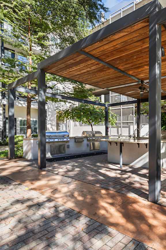 a patio with a table and chairs under a canopy