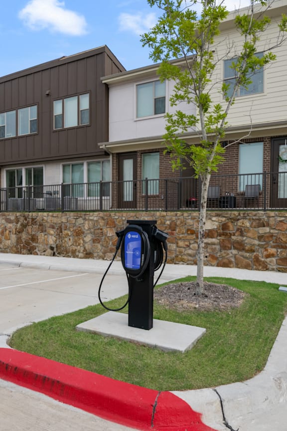 an electric car is being charged at a charging station