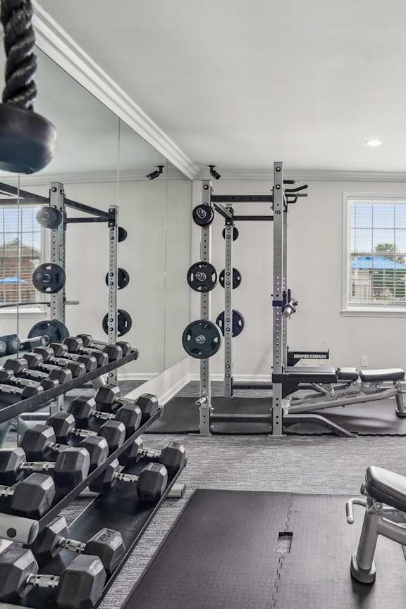 A well-equipped gym with a variety of exercise equipment.