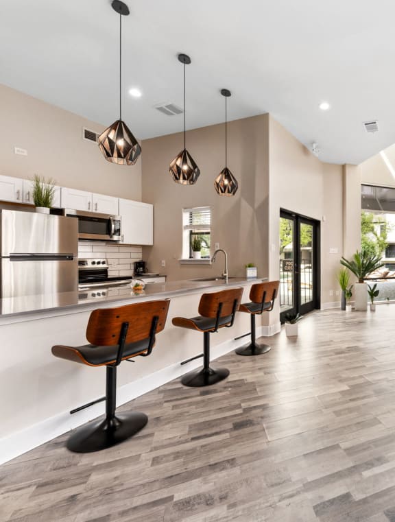 a large living room with a kitchen and a dining room