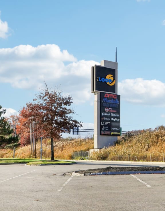 a parking lot with a sign for a gas station