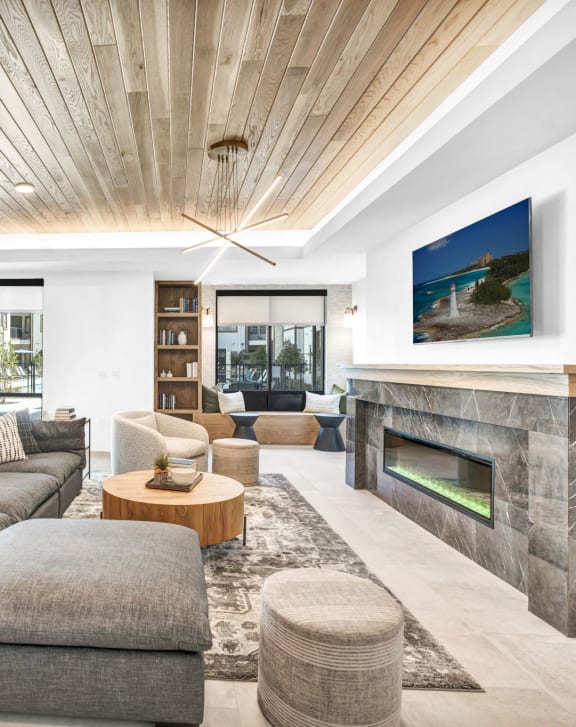 a living room with couches and a fireplace