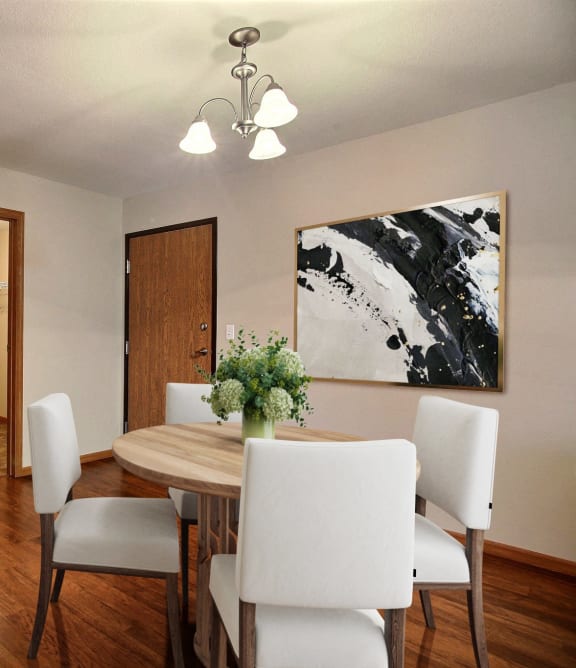a dining room with a wooden table and white chairs