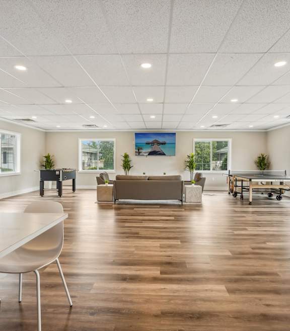 a kitchen with a blue counter top and a living room