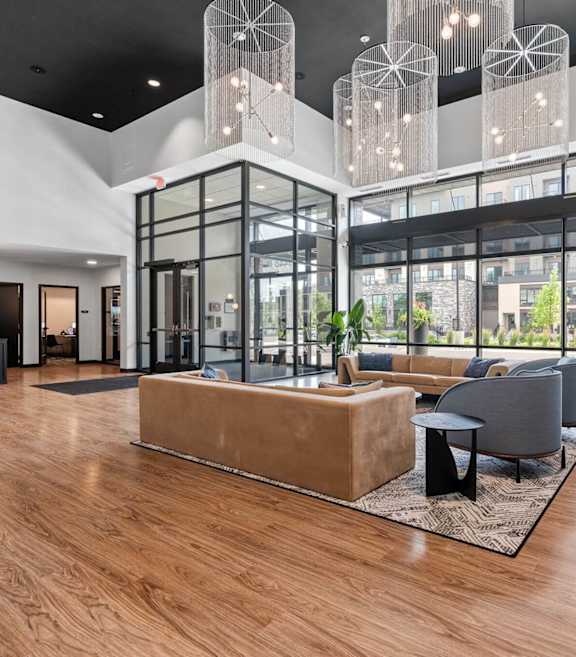 A modern interior with a wooden floor and a glass wall.