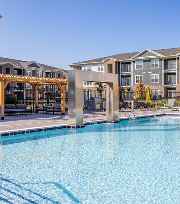 A large swimming pool in front of apartment buildings. at Viridian Apartments LLC Apartments, Kentucky