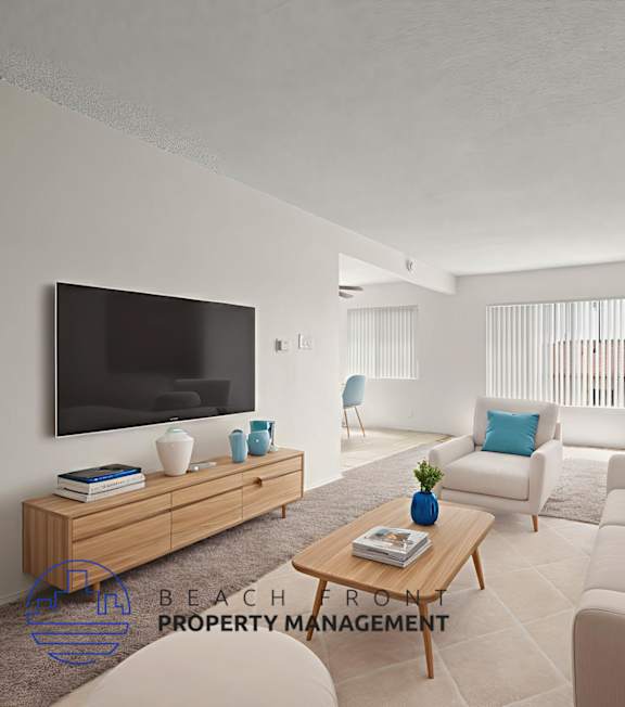 A living room with a television, sofas, and a coffee table.