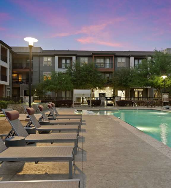 Axis Marketplace Apartments in Kyle, Texas Pool with Lounge Chairs
