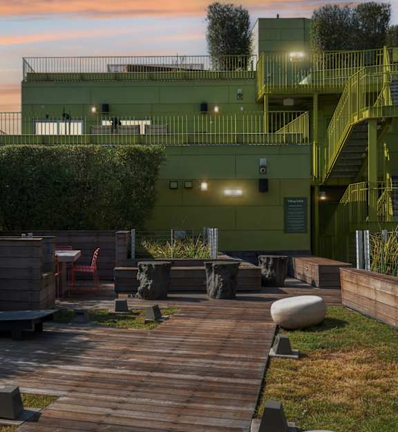 a rooftop deck with a view of the city