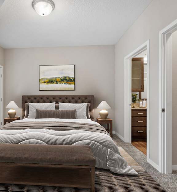 A bedroom with a large bed and a painting on the wall.