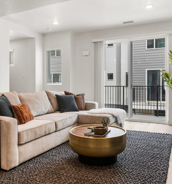 a living room with a large couch and a coffee table