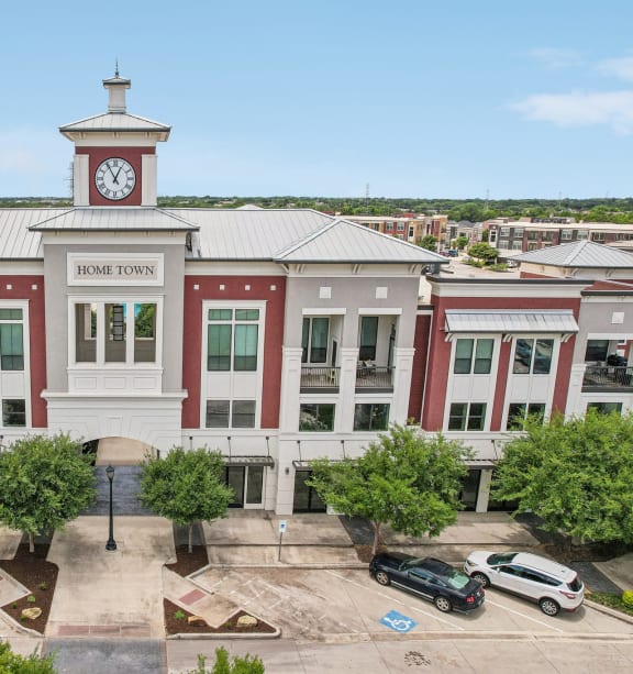 an aerial view of a building with a clock tower