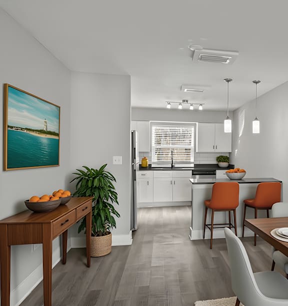 Mandarin Bay Apartments dining area and kitchen with a wooden table, light grey chairs, and orange barstools.