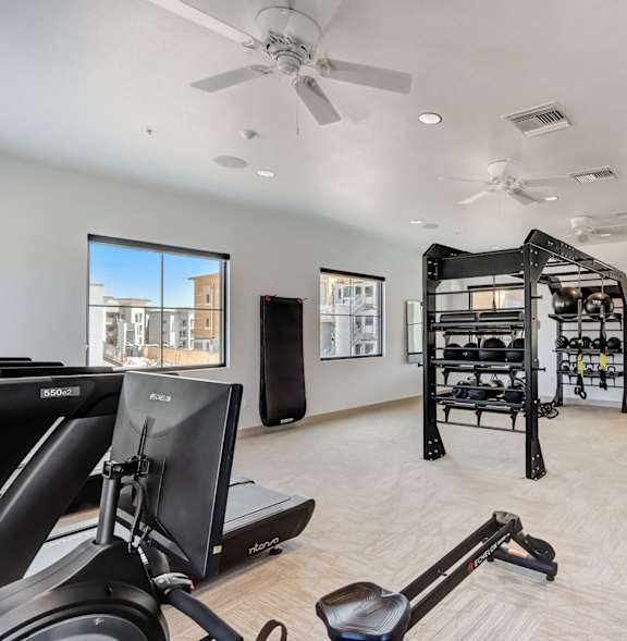 A gym with treadmills, a bench, and a weight machine.