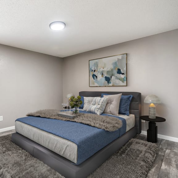 a bedroom with a bed and a chair and a window