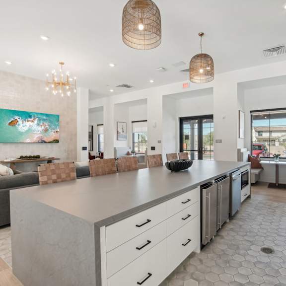 the kitchen is open to the living room and dining room at The Maddox Luxury Apartment Homes, Buckeye, AZ 85326