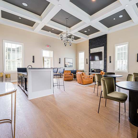 A large room with a white table and chairs.