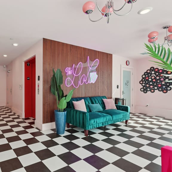 A living room with a black and white checkered floor.