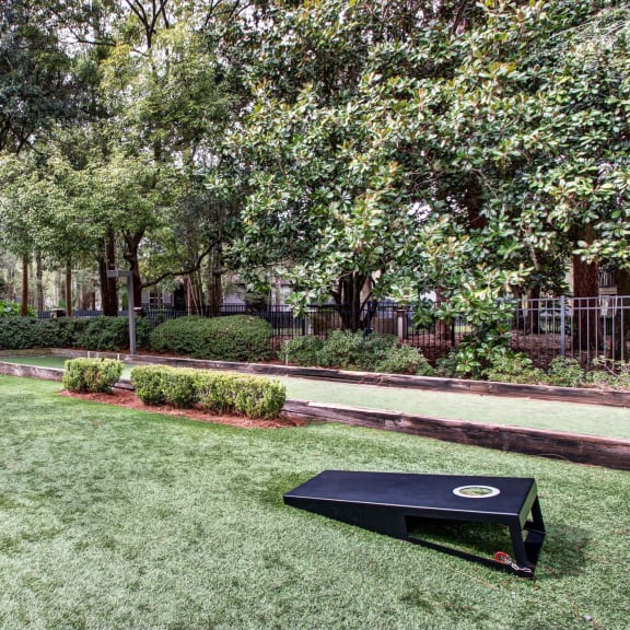 a backyard with a ping pong table and a bench at Timberwalk at Mandarin, Jacksonville, Florida
