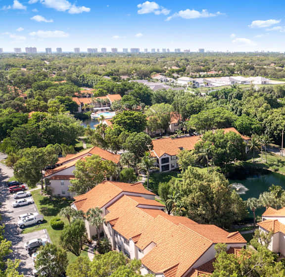 A bird's eye view of a residential area with houses and trees.