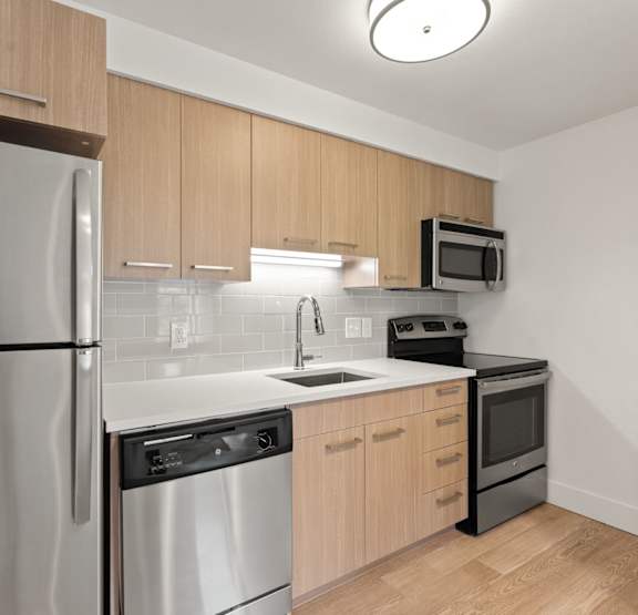 Living Area With Kitchen at AVIA Lofts on Parkway, Vancouver, Washington