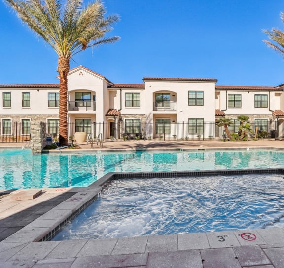 the pool is surrounded by palm trees and plants at Stella, San Tan Valley, AZ 85143