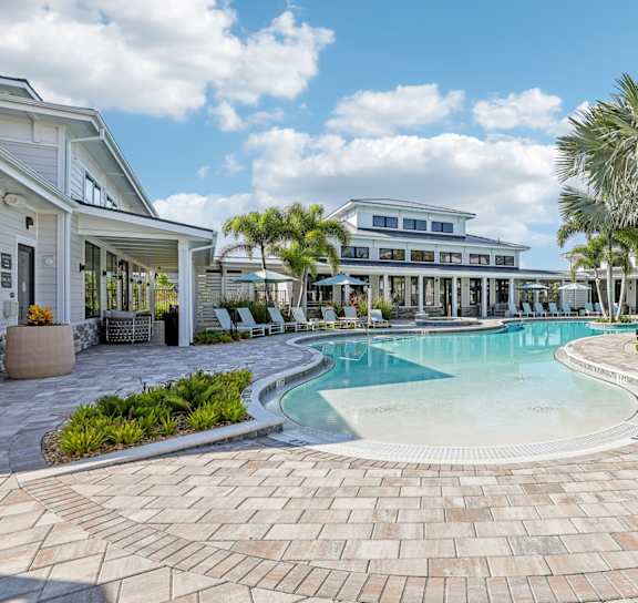 the pool is surrounded by palm trees and plants at Drift, Daytona Beach, FL, 32117