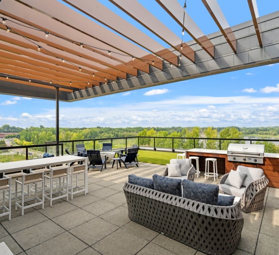 5th Floor Sky Terrace Featuring Pergola With  String Lights, Dining Area & Firepit