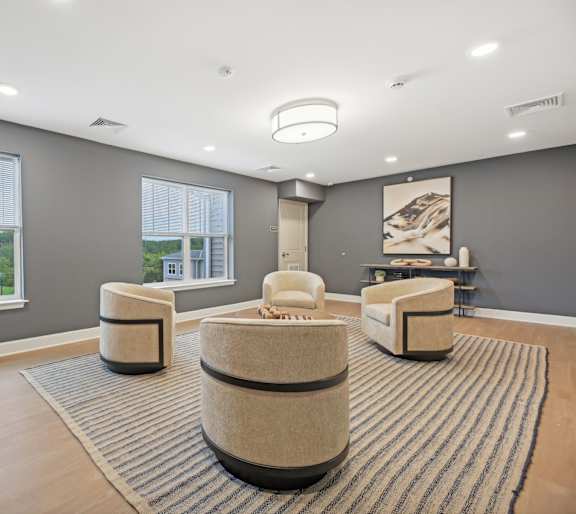 a bedroom with a bed with white sheets and pillows