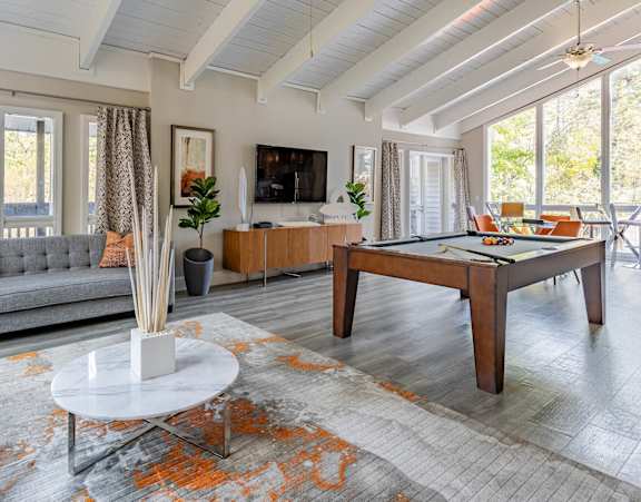 a living room and dining room with large windows at Tucker Square, Stone Mountain, Georgia