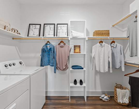A white laundry room with a washer and dryer.
