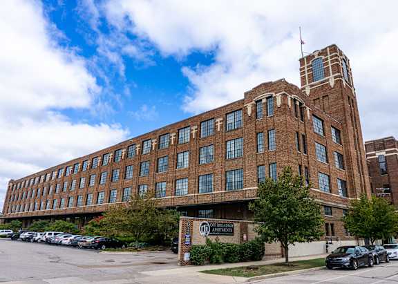Exterior of Off Broadway Apartments, a brick loft building on the west side of downtown Grand Rapids