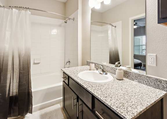 a bathroom with a toilet sink and bathtub