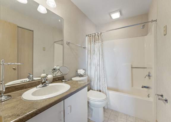 a bathroom with a toilet sink and bathtub