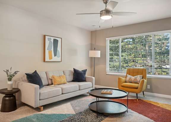 a living room with a couch and a chair