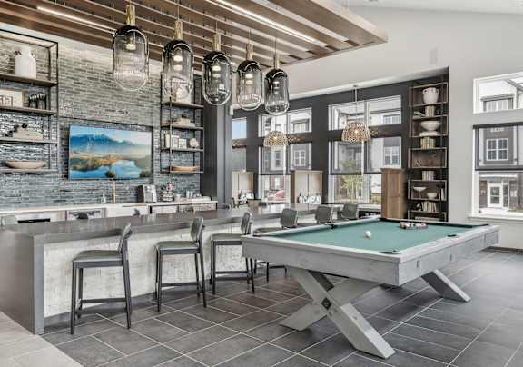 a rendering of a lobby with a bar and tables