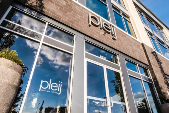 the exterior of a posh building with a sign in the window