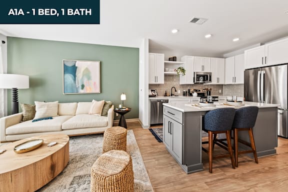 A modern kitchen with a breakfast bar and a living room area.