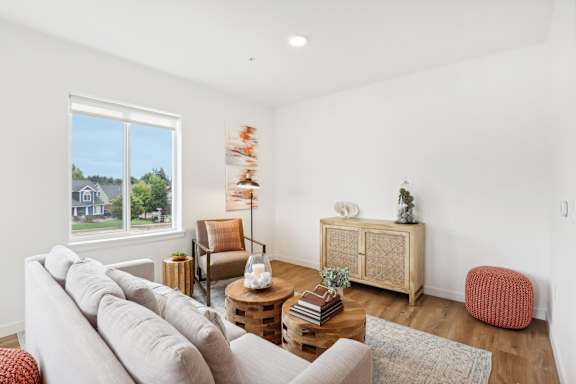 a living room with a couch and a window